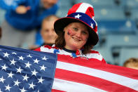 A USA fan holds an American flag during the Women's Football first round Group G match between United States and Colombia on Day 1 of the London 2012 Olympic Games at Hampden Park on July 28, 2012 in Glasgow, Scotland. (Getty Images)