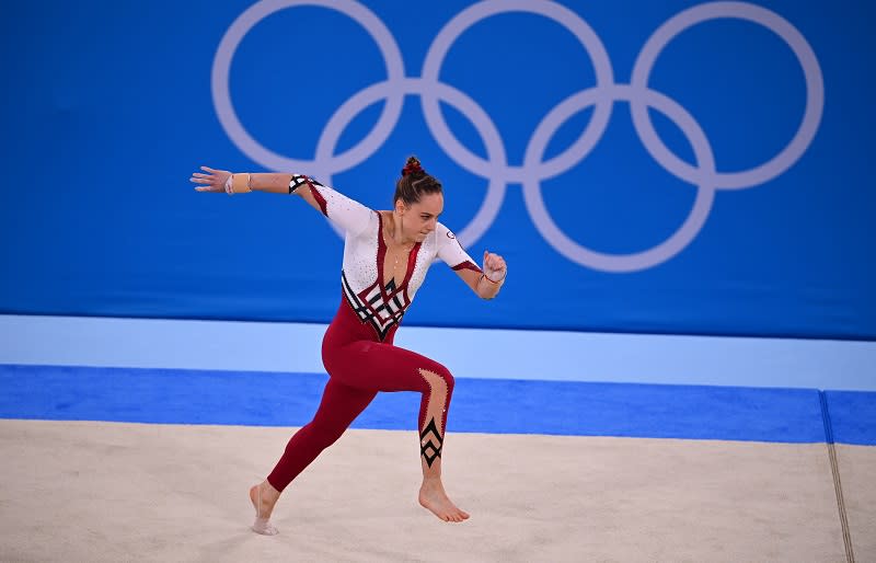 Sarah Voss of Germany sports a full-length unitard during the floor exercise. Image credit: Reuters/Dylan Martinez