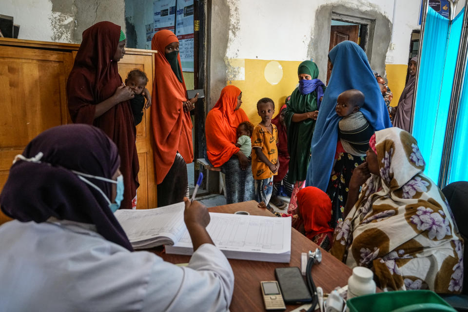 A doctor registers patients recently displaced from drought-affected regions at a Trocaire-supported hospital in Doolow. According to World Food Program figures, between August 2022 and July 2023, 1.8 million children face acute malnutrition, including 513,550 facing severe malnutrition. (Giles Clarke)