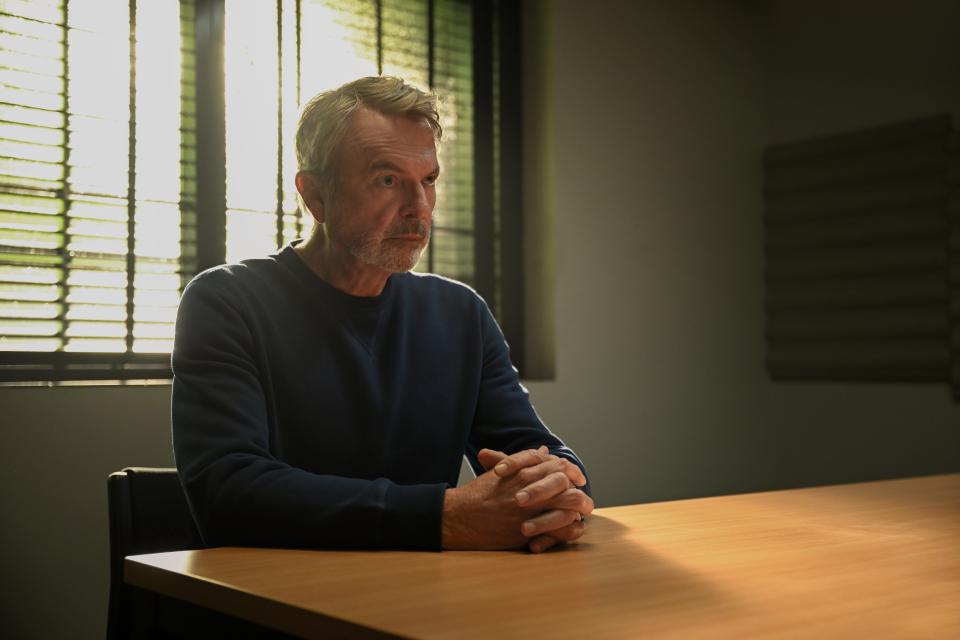 Sam Niell as family patriarch Stan Delaney undergoes questioning after his wife Joy (Annette Bening) mysteriously disappears in "Apples Never Fall," a new Peacock series based on a book by Liane Moriarty.