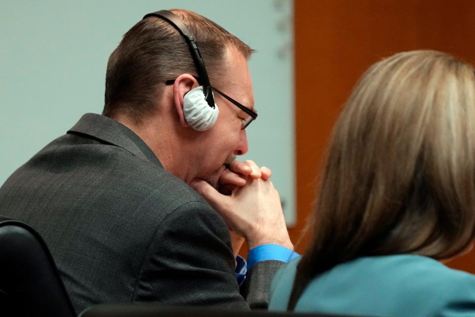 James Crumbley gets emotional after watching the video of his son walking through the halls of Oxford H.S. in a video shown in the Oakland County courtroom Friday, March 8, 2024, in Pontiac, Mich. Crumbley is on trial for involuntary manslaughter. He's accused of contributing to the tragedy at Oxford High School by failing to properly secure a gun used by son Ethan Crumbley. Four students were killed and more were wounded. (AP Photo/Carlos Osorio, Pool)