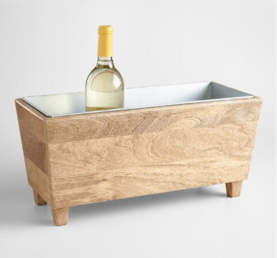 <p>World Market</p><p><strong>$59.99</strong></p><p>For the host who throws seriously festive parties, this wooden wine chilling trough is a soirée saver. </p>