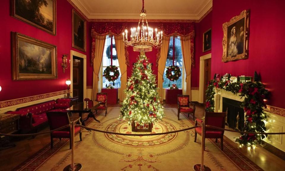 The Red Room of the White House where the tree is decorated with handmade ornaments honouring those fighting the pandemic.