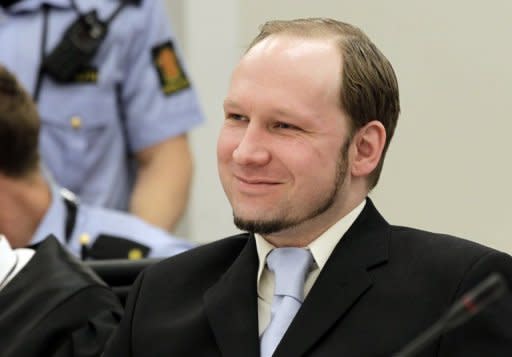 Mass killer Anders Behring Breivik smiles during his trial in room 250 of Oslo's central court on Thursday. Breivik, who killed 77 people in Norway last July, should be locked up in a psychiatric ward instead of prison, the prosecution said Thursday, arguing his sanity had not been proven beyond a reasonable doubt