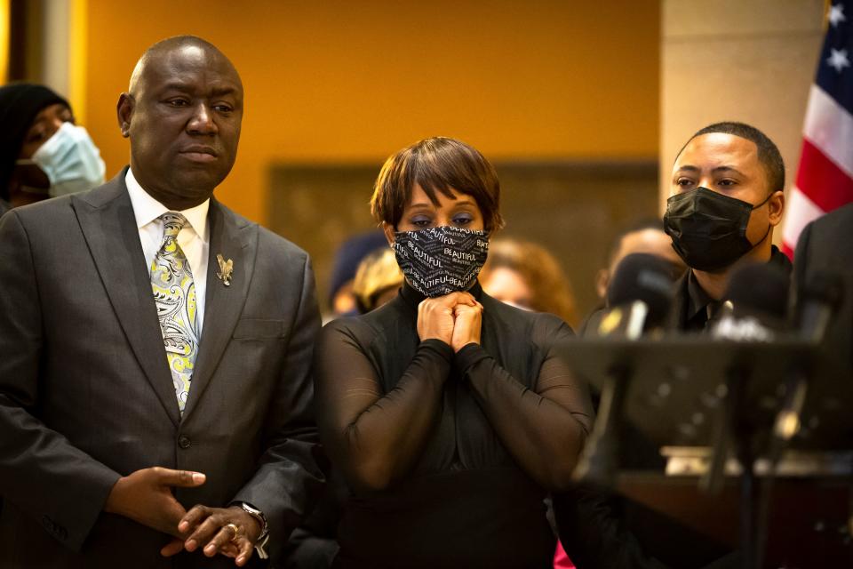 Civil rights attorney Ben Crump, left, at a news conference with Andre Locke, right, and Karen Wells, center, 