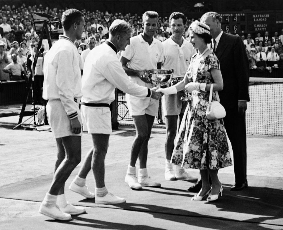 Queen Elizabeth II congratulates Tennis players during 1957 Wimbledon Championships tennis tournament on July 1957 (INTERCONTINENTALE/AFP via Getty)