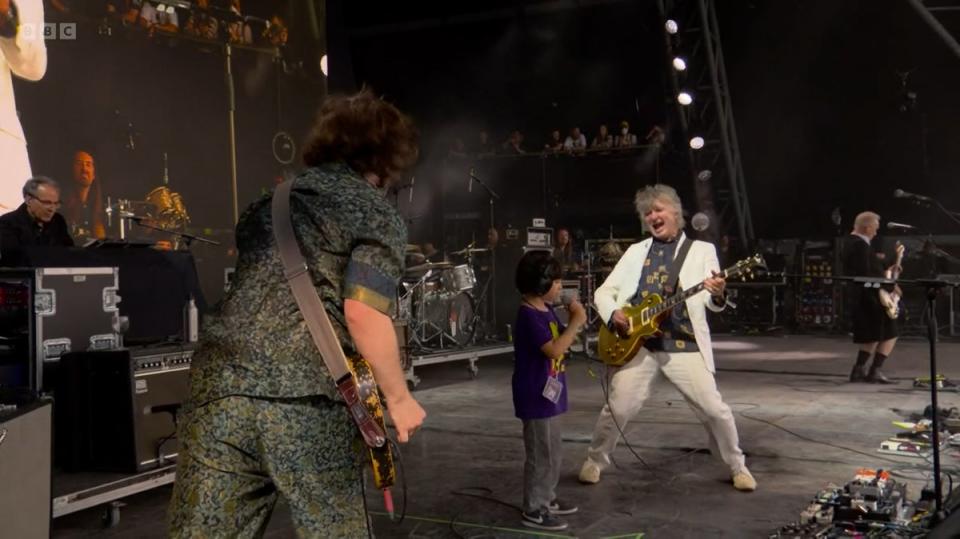 Buddy rocked along with his father and grandfather at Glastonbury (BBC/PA) (PA Media)