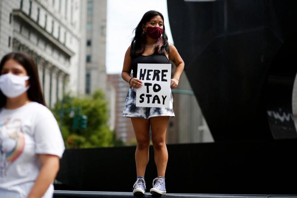 PHOTO: A woman holds a banner during a protest supporting DACA, Deferred Action for Childhood Arrivals, at Foley Square in New York, on Aug. 17, 2021.  (Kena Betancur/AFP via Getty Images, FILE)