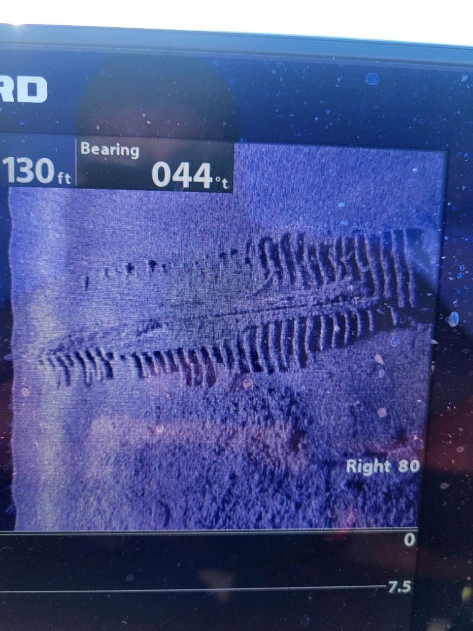 Tim Wollak captures a photo of an unknown shipwreck from his boat on Lake Michigan's Green Bay. Historians later told him he discovered the long-lost wrecked George L. Newman.