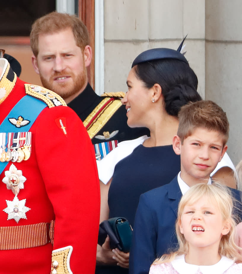 Prince Harry and Meghan Markle talking at Trooping the Colour at Buckingham Palace