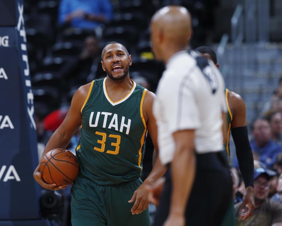 FILE - In this Tuesday, Jan. 24, 2017, file photo, Utah Jazz center Boris Diaw, back, reacts after being called for a foul against the Denver Nuggets during the second half of an NBA basketball game in Denver. Diaw and Rudy Gobert, both veterans, said having a teammate from their native country can help young players focus on just basketball. (AP Photo/David Zalubowski, File)