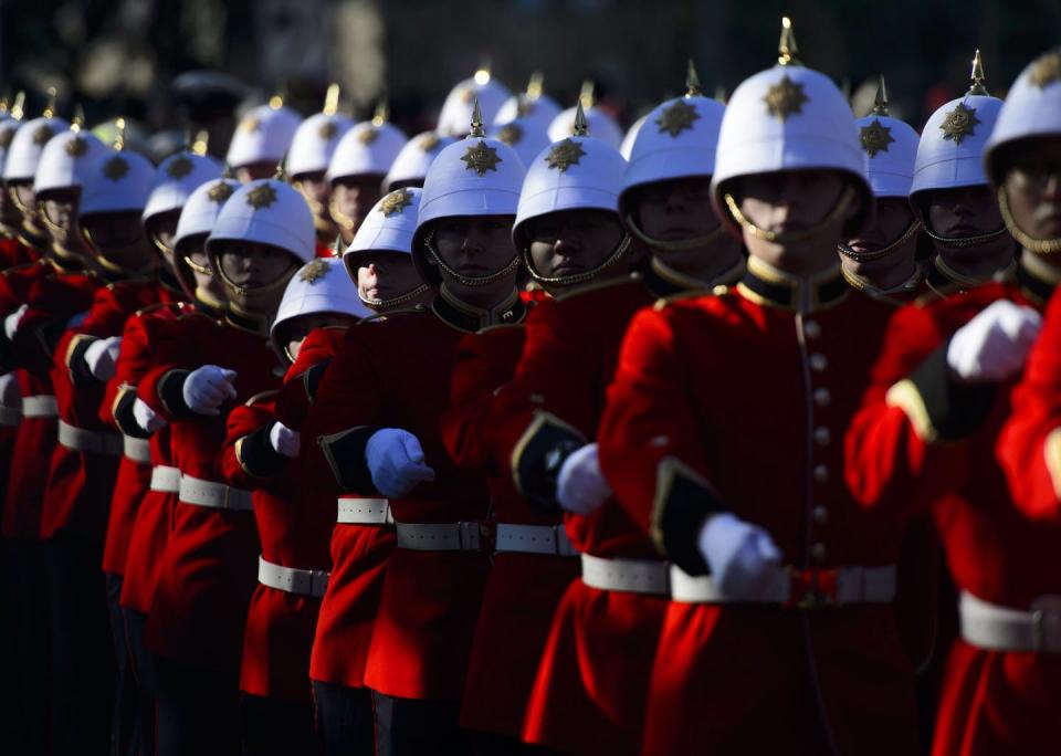 Canadian soldiers march in formation.