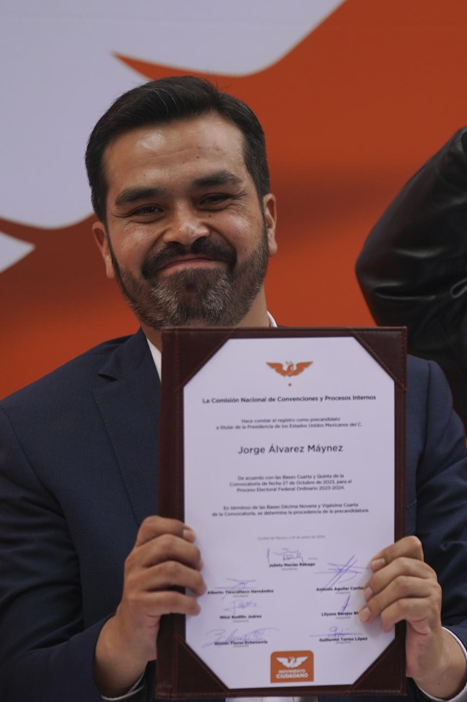 Rep. Jorge Álvarez Máynez holds his registration certificate after he was nominated by the Citizen’s Movement party to run for president in the upcoming general elections, in Mexico City, Wednesday, Jan. 10, 2024. The 38-year-old congressman will face front-runner Claudia Sheinbaum of the ruling Morena party, and opposition coalition candidate Xochitl Gálvez on June 2. (AP Photo/Fernando Llano)