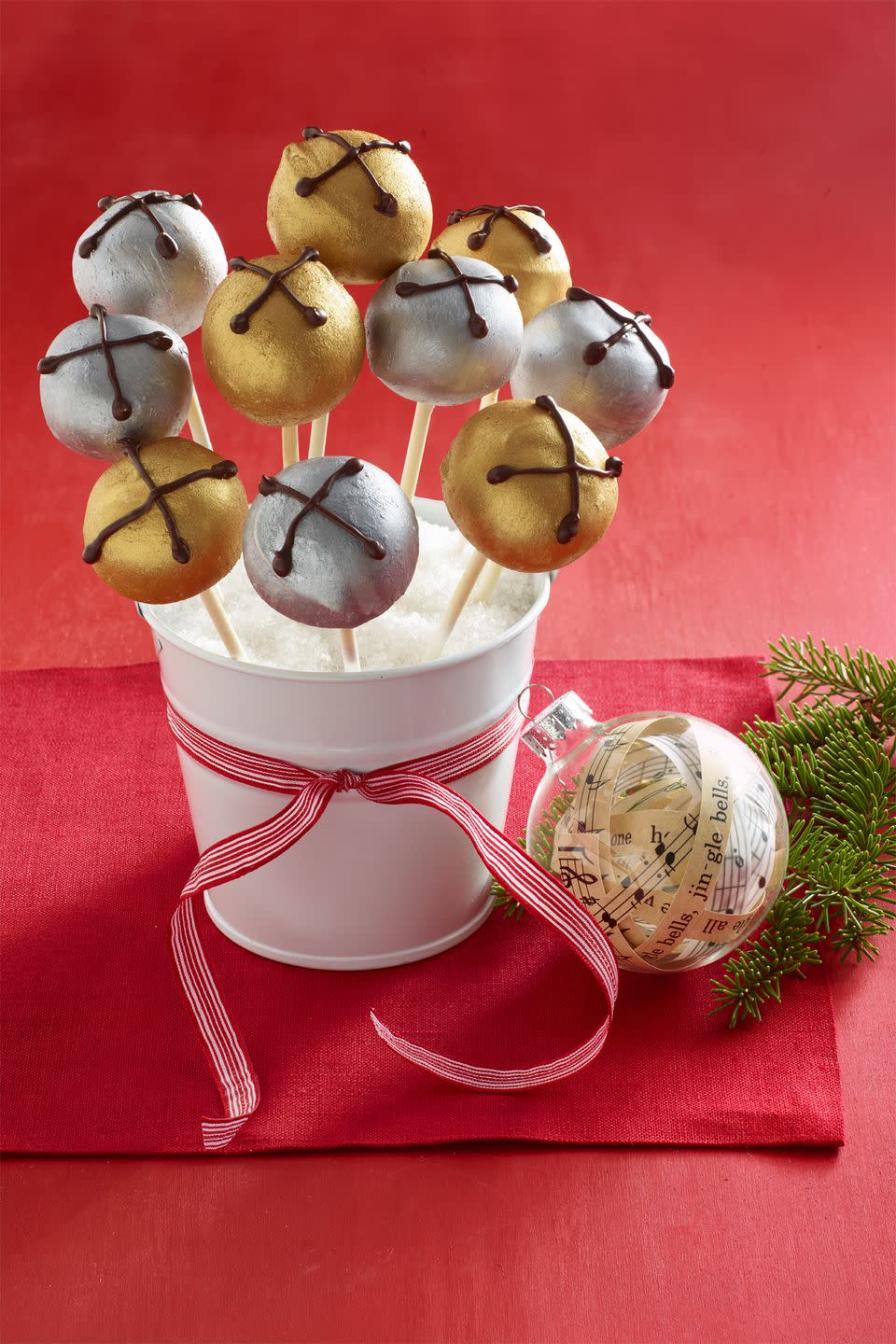 <p>Wrap these pops in plastic wrap and give them out to neighborhood kids and cousins as a tasty treat.</p><p><a href="https://www.womansday.com/food-recipes/food-drinks/recipes/a56908/jingle-bells-peanut-butter-pops-recipe/" rel="nofollow noopener" target="_blank" data-ylk="slk:Get the Jingle Bells Peanut Butter Pops recipe.;elm:context_link;itc:0;sec:content-canvas" class="link "><em><strong>Get the Jingle Bells Peanut Butter Pops recipe.</strong></em></a> </p>