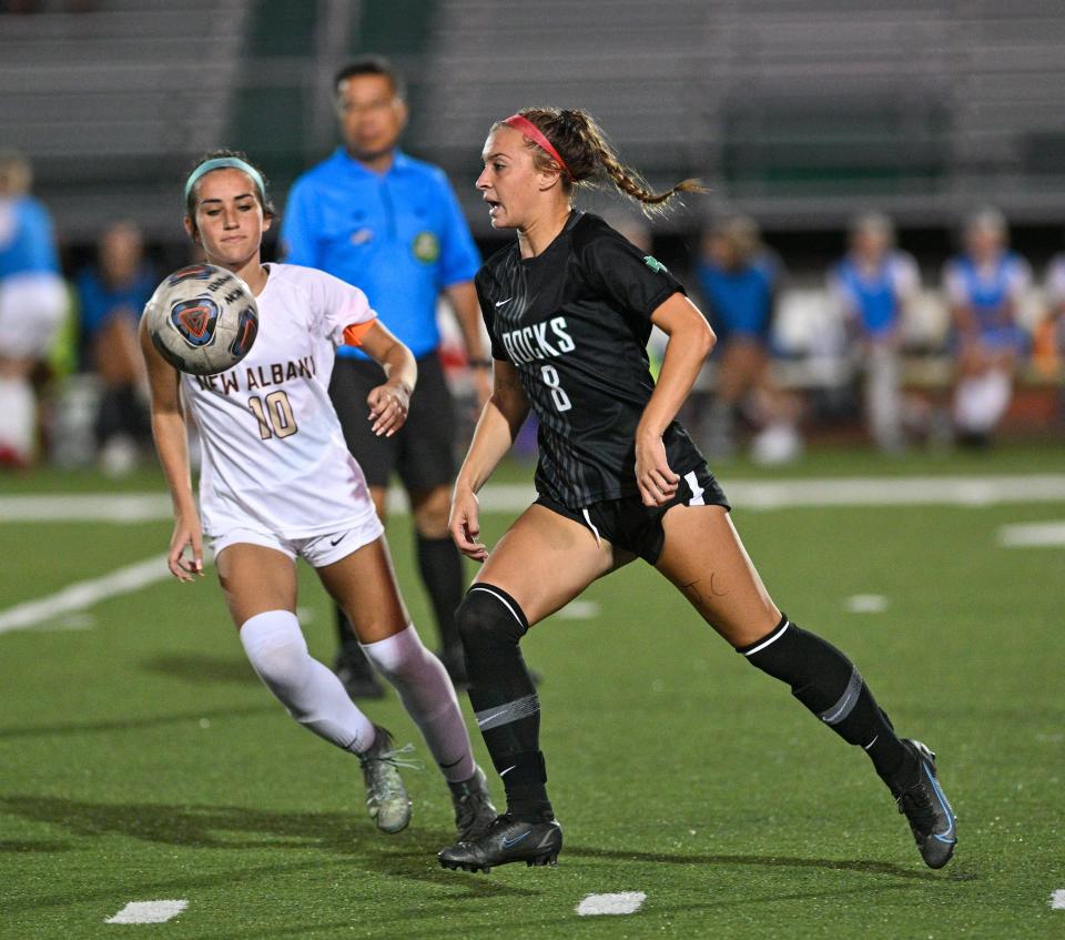Dublin Coffman’s Taylor Duff, right, and New Albany’s Allie Metcalf go for the ball during a game last season.