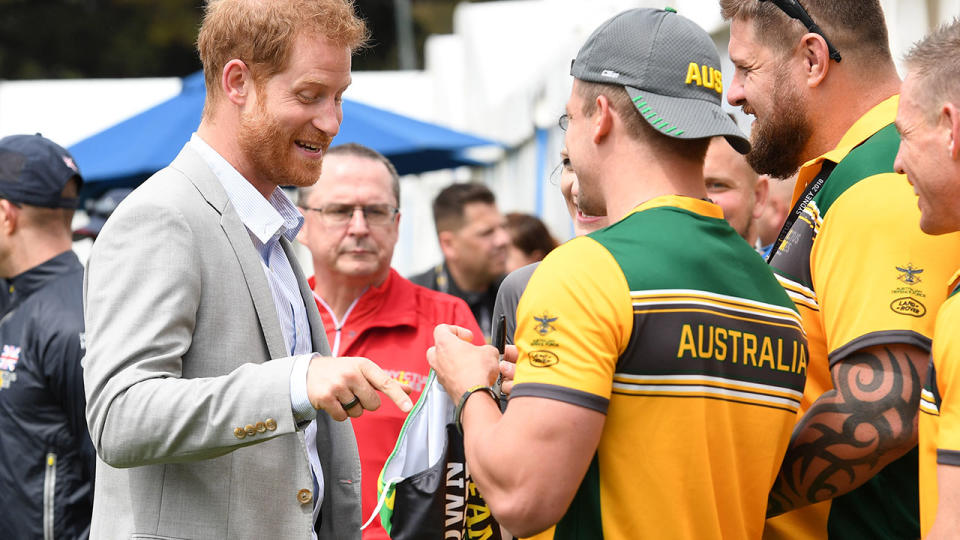 Prince Harry was a great sport. (Photo by Karwai Tang/WireImage)