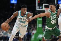 Charlotte Hornets' Brandon Miller (24) drives past Boston Celtics' Jaden Springer (44) during the first half of an NBA basketball game, Friday, April 12, 2024, in Boston. (AP Photo/Michael Dwyer)