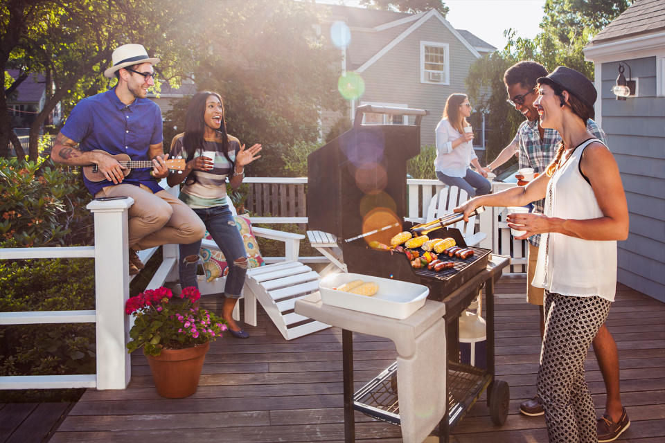 Friends enjoying barbecue on patioGetty Images/Strauss/Curtis