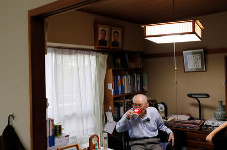 Baek Chong Won, 95, an ethnic North Korean living in Japan, drinks water during his interview with Reuters at his house in Tokyo, Japan, May 27, 2018. REUTERS/Kim Kyung-Hoon