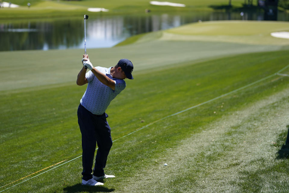 Gary Woodland hits from the rough on the 16th hole during first round of the Wells Fargo Championship golf tournament at the Quail Hollow Club on Thursday, May 4, 2023, in Charlotte, N.C. (AP Photo/Chris Carlson)