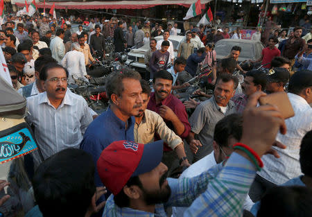 Waseem Akhtar, mayor of Karachi and member of the Muttahida Qaumi Movement (MQM) political party is greeted by supporters after his release from the Central Prison in Karachi, Pakistan, November 16, 2016. REUTERS/Akhtar Soomro