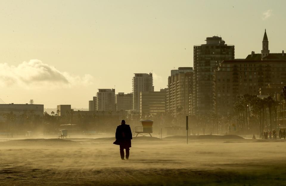 Cold, gusty winds raise clouds of dust in Long Beach