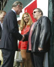 FILE - Britain's Prince Charles, left, meets performers including singer Beyonce, center, and Meat Loaf following the 'Party in the Park' event in Hyde Park, London Sunday July 6, 2003. Meat Loaf, the rock superstar loved by millions for his “Bat Out of Hell” album and for such theatrical, dark-hearted anthems as “Paradise by the Dashboard Light” and “Two Out of Three Ain’t Bad,” has died at age 74. A family statement on his official Facebook page says the singer born Marvin Lee Aday died Thursday night, Jan. 20, 2022. “Bat Out of a Hell,” his mega-selling collaboration with songwriter Jim Steinman, came out in 1977 and became one of the bestselling records in history.(Russell Boyce, Pool Photo via AP, File)