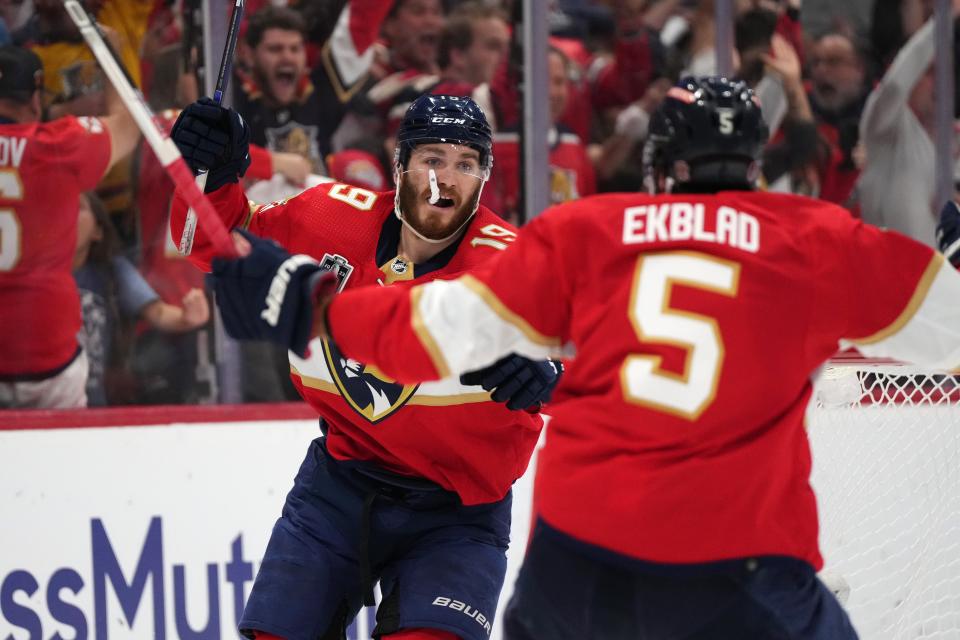 Florida Panthers left wing Matthew Tkachuk celebrates his tying goal with defenseman Aaron Ekblad.