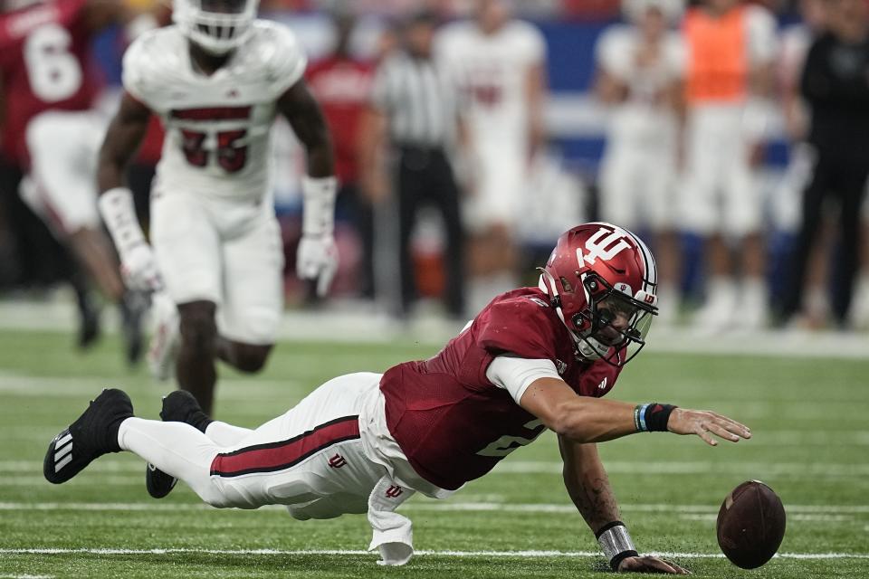 Indiana quarterback Tayven Jackson recovers a fumble during the first half of an NCAA college football game against Louisville, Saturday, Sept. 16, 2023, in Indianapolis. (AP Photo/Darron Cummings)