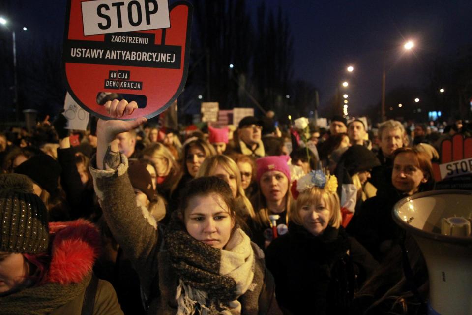 People gather to protest against plans to further restrict abortion laws in Warsaw: Reuters