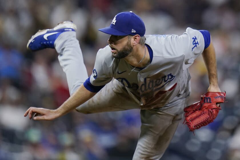 Los Angeles Dodgers relief pitcher Chris Martin watches a throw to a San Diego Padres.