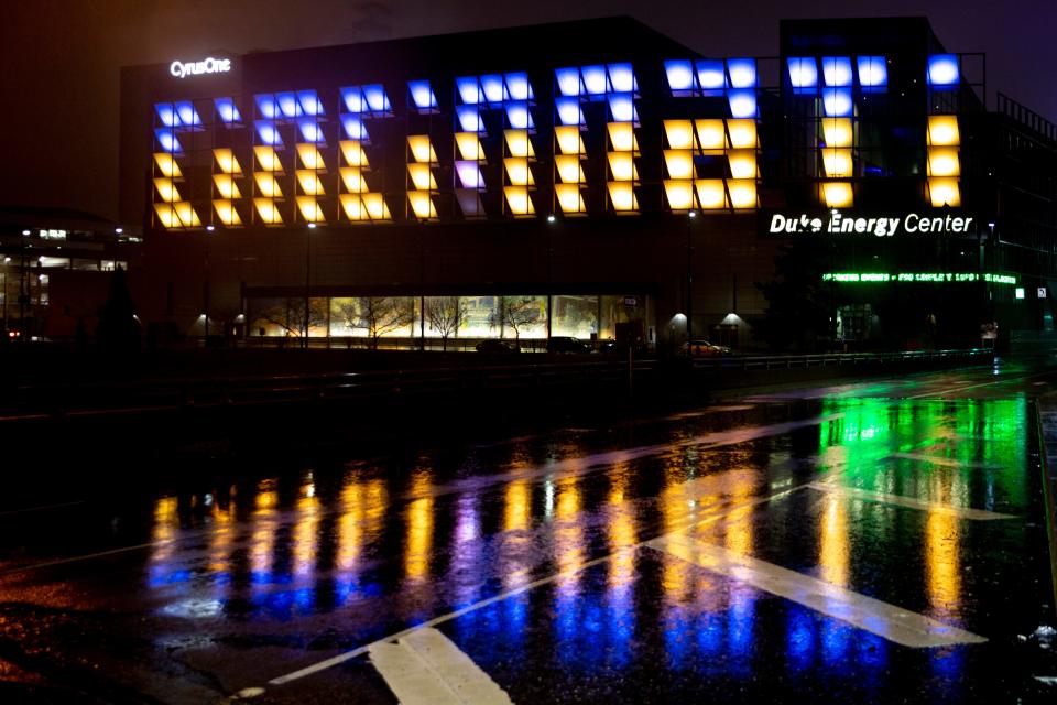 The Cincinnati sign at the Duke Energy Center is displayed in the colors of the Ukrainian flag on Friday, Feb. 25, 2022. 