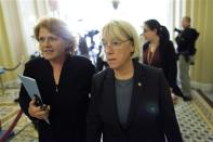 U.S. Senator Patty Murray (D-WA) (C) walks to a Senate Democratic caucus luncheon at the U.S. Capitol in Washington, October 15, 2013. REUTERS/Jonathan Ernst