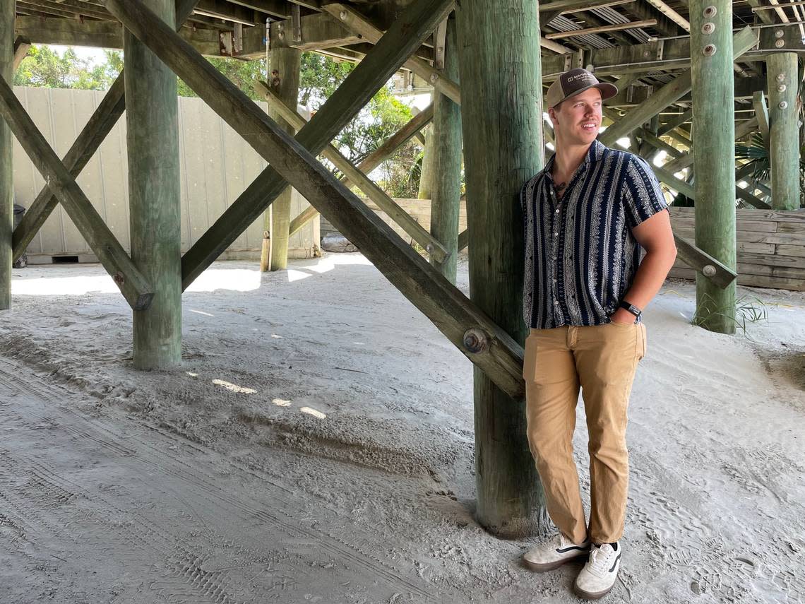 Luke Lowder, writer of “The Grand Strand,” film, stands under the pier at Apqche Family Campground and Pier in Myrtle Beach. The movie, which will began filming in June, is about his summers at the campground.