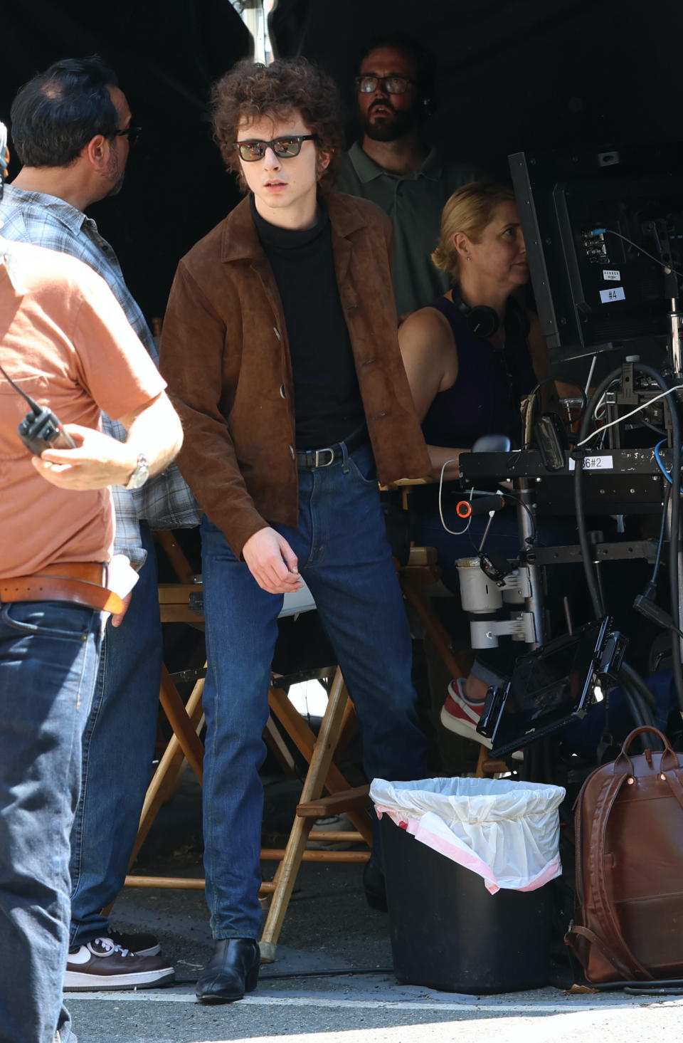 Timothee Chalamet is seen on the set of "A Complete Unknown" wearing a pair of chelsea boots