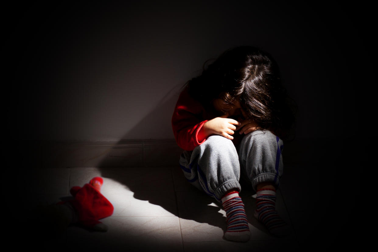 Baby girl sitting in the dark. (PHOTO: Getty Images)