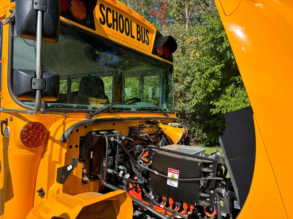 One of the Palmyra-Eagle Area School District's electric school buses is shown here with the hood raised to reveal its electric engine.