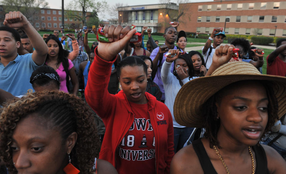 WASHINGTON, DC - MARCH 22: Howard University students held up bags of Skittles as they sang the Negro National Anthem during a vigil for Trayvon Martin on the campus of Howard University on March 22, 2012, in Washington, DC. (Photo by Jahi Chikwendiu/The Washington Post via Getty Images)