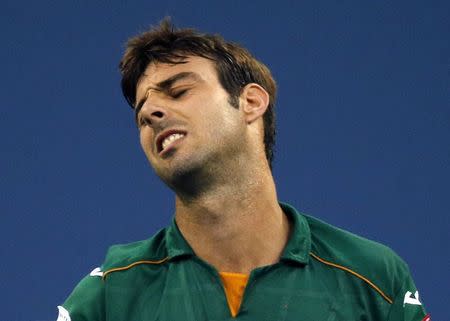 Marcel Granollers of Spain reacts after missing a point against Roger Federer of Switzerland in the men's singles play during their match at the 2014 U.S. Open tennis tournament in New York, August 31, 2014. REUTERS/Ray Stubblebine