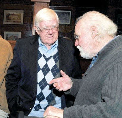 Former Catholic Memorial athletic director Jim O'Connor, left, talks to his longtime friend of more than seven decades, John Lyons, at the Olde Country Cafe in November 2011. Friends gathered for a dinner honoring O'Connor, who had the football field at Catholic Memorial School in West Roxbury named after him. O'Connor was the school's first varsity football coach, a position he held for 19 years.