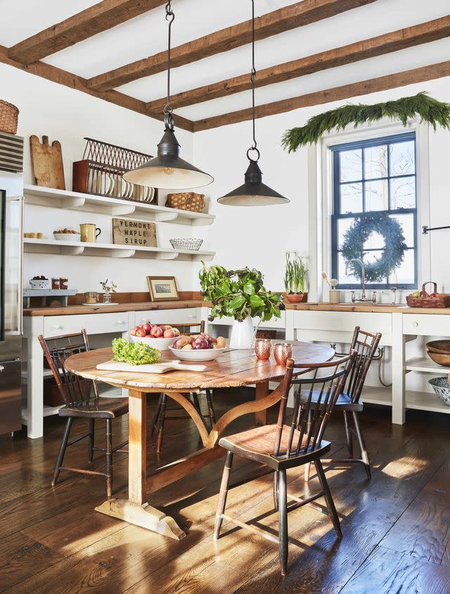 a kitchen with a dining table and chairs