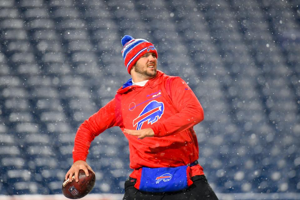 Bills quarterback Josh Allen warms up in the snow storm before playing the Patriots on Dec. 6.
