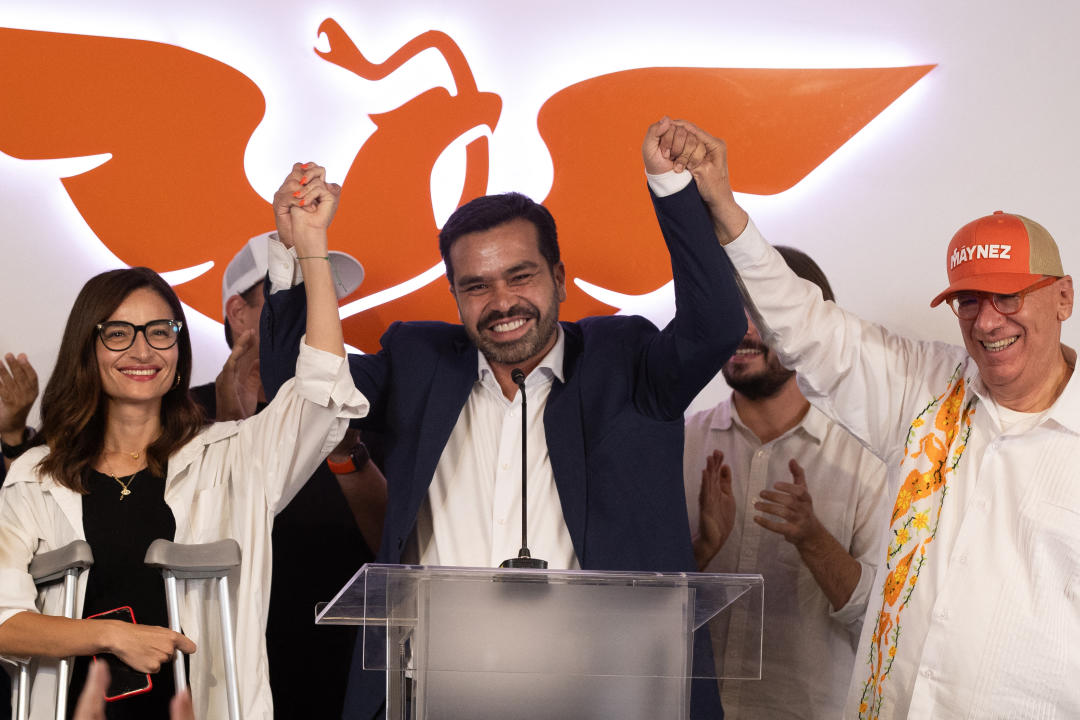 Presidential candidate Jorge Alvarez Maynez (C) holds hands with Laura Ballesteros (L) and Dante Delgado (R) after losing the Mexican presidential election in Mexico City on June 3, 2024. Claudia Sheinbaum was set to be elected Mexico's first woman president, exit polls showed, a milestone in a country with a history of gender-based violence. (Photo by EDUARDO MEJIA / AFP) (Photo by EDUARDO MEJIA/AFP via Getty Images)