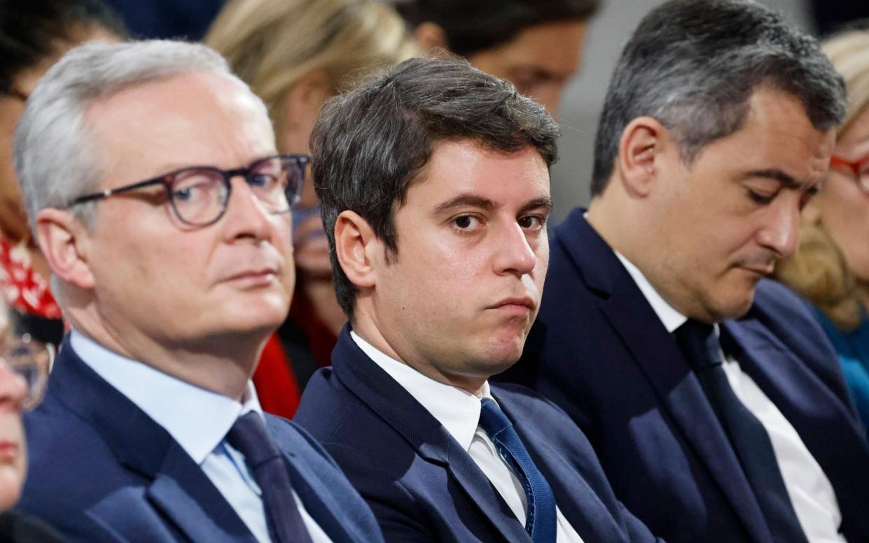 Finance minister Bruno Le Maire, left, with the French prime minister Gabriel Attal, centre