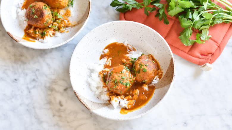 turkey meatballs with rice and curry sauce in bowls