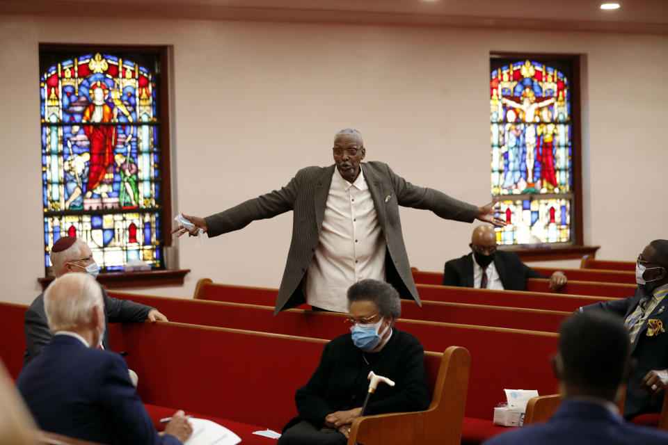 Bishop Thomas Wesley Weeks stands as he speaks to Democratic presidential candidate, former Vice President Joe Biden, left, at Bethel AME Church in Wilmington, Del., Monday, June 1, 2020. (AP Photo/Andrew Harnik)