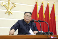 In this undated photo provided Saturday, Feb. 29, 2020, by the North Korean government, North Korean leader Kim Jong Un speaks during a ruling Workers’ Party's meeting in North Korea. North Korean leader Kim has called for stronger anti-virus efforts to guard against COVID-19, saying there will be “serious consequences” if the illness spreads to the country. Independent journalists were not given access to cover the event depicted in this image distributed by the North Korean government. The content of this image is as provided and cannot be independently verified. Korean language watermark on image as provided by source reads: "KCNA" which is the abbreviation for Korean Central News Agency. (Korean Central News Agency/Korea News Service via AP)