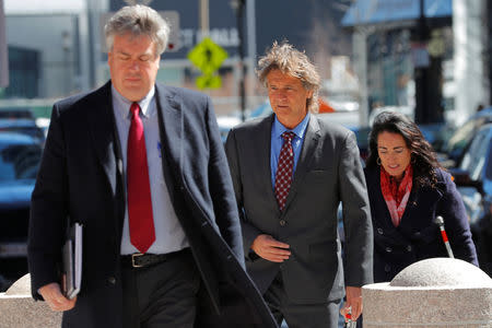 Jovan Vavic (C), former water polo coach at the University of Southern California (USC) facing charges in a nationwide college admissions cheating scheme, arrives at the federal courthouse in Boston, Massachusetts, U.S., March 25, 2019. REUTERS/Brian Snyder
