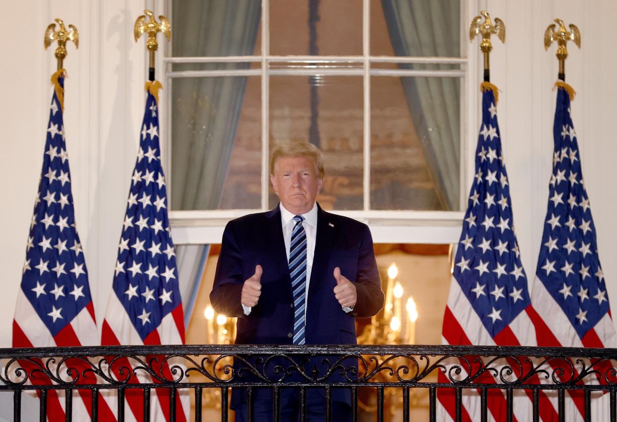 <p>U.S. President Donald Trump gives a thumbs up upon returning to the White House from Walter Reed National Military Medical Center on October 05, 2020 in Washington, DC</p> (Getty Images)