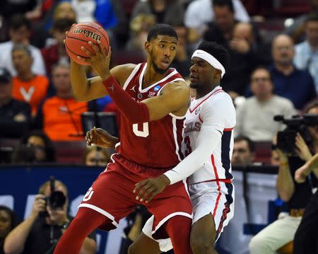 Mar 22, 2019; Columbia, SC, USA; Oklahoma Sooners guard Christian James (0) is defended by Mississippi Rebels guard Terence Davis (3) during the second half in the first round of the 2019 NCAA Tournament at Colonial Life Arena. Mandatory Credit: Bob Donnan-USA TODAY Sports